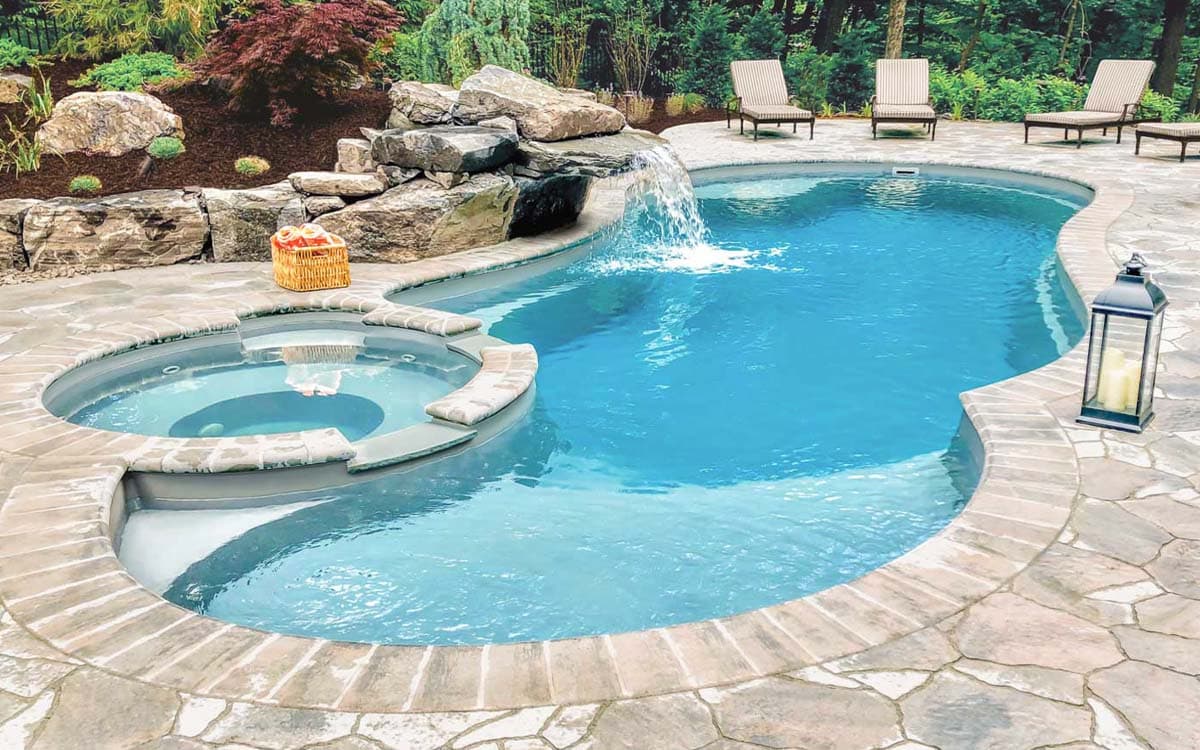 Crystal-clear residential pool with spa